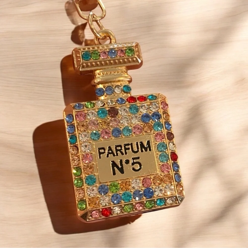 Elegant Rainbow crystal adorned Parfum bottle Goldtone keychain - Picture 2 of 7